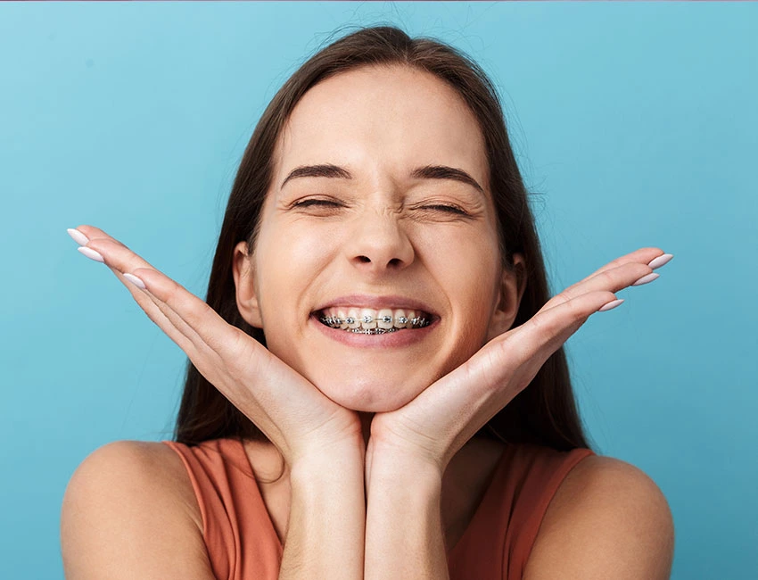 othodontics-braces-happy.webp