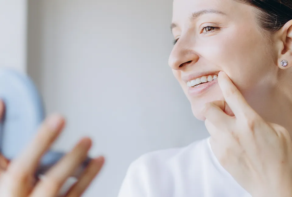 patient-checking-her-dental-work.webp